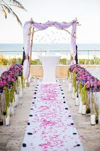 B Wood Chuppah with Purple flowers in runner Marriot South Beach